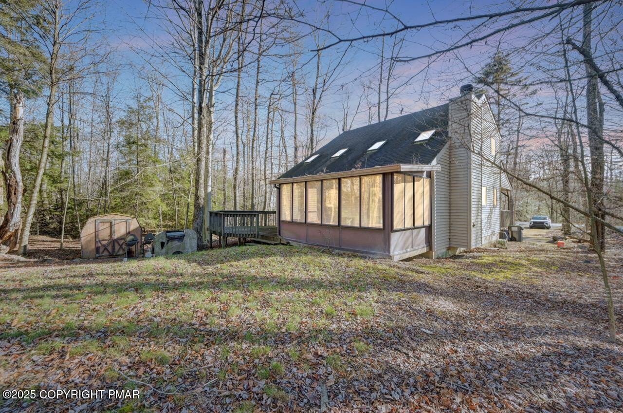 Image 4: Rear 3 Season Room & Deck View