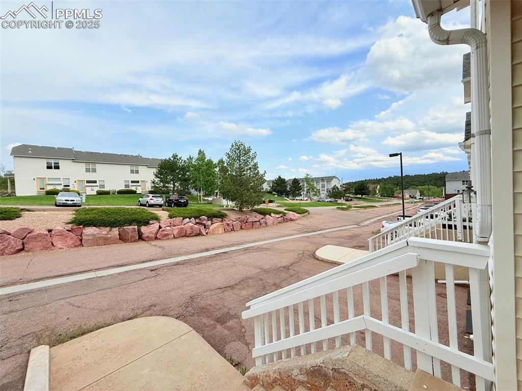 Image 2: View of yard with a balcony