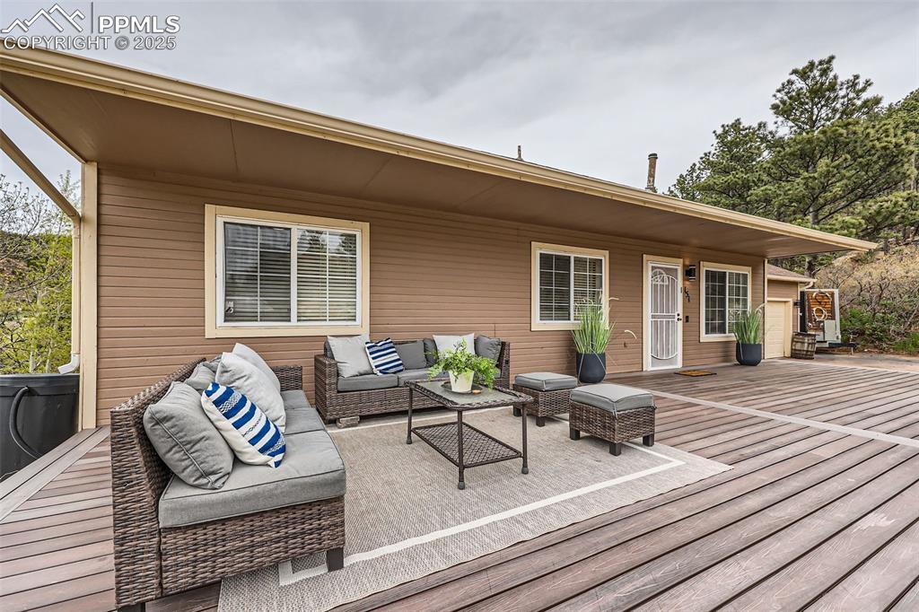 Image 2: Wooden deck with an outdoor living space