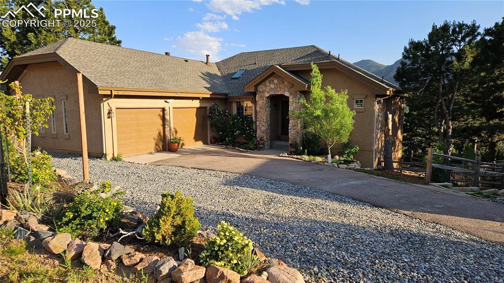 Image 1: Welcome home! If you love million dollar views, walking access to your own hamlet, parks, trails  and ice cream then this could all be yours.  Home has stucco and stone siding, new roof, lovely landscaping and much more!