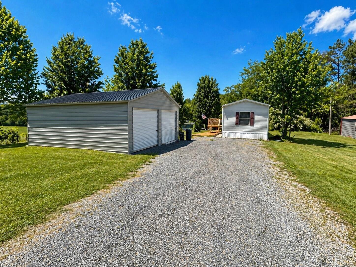 Image 2: MLS_Photo_07_AI_Garage_Home_Driveway