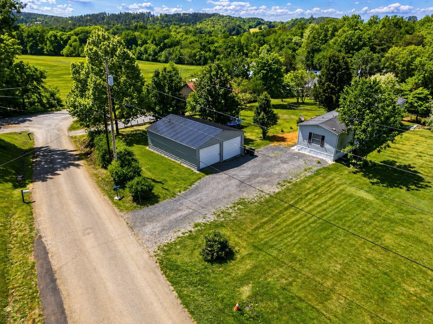 Image 3: MLS_AI_Aerial_Garage_Home_IMG_0178