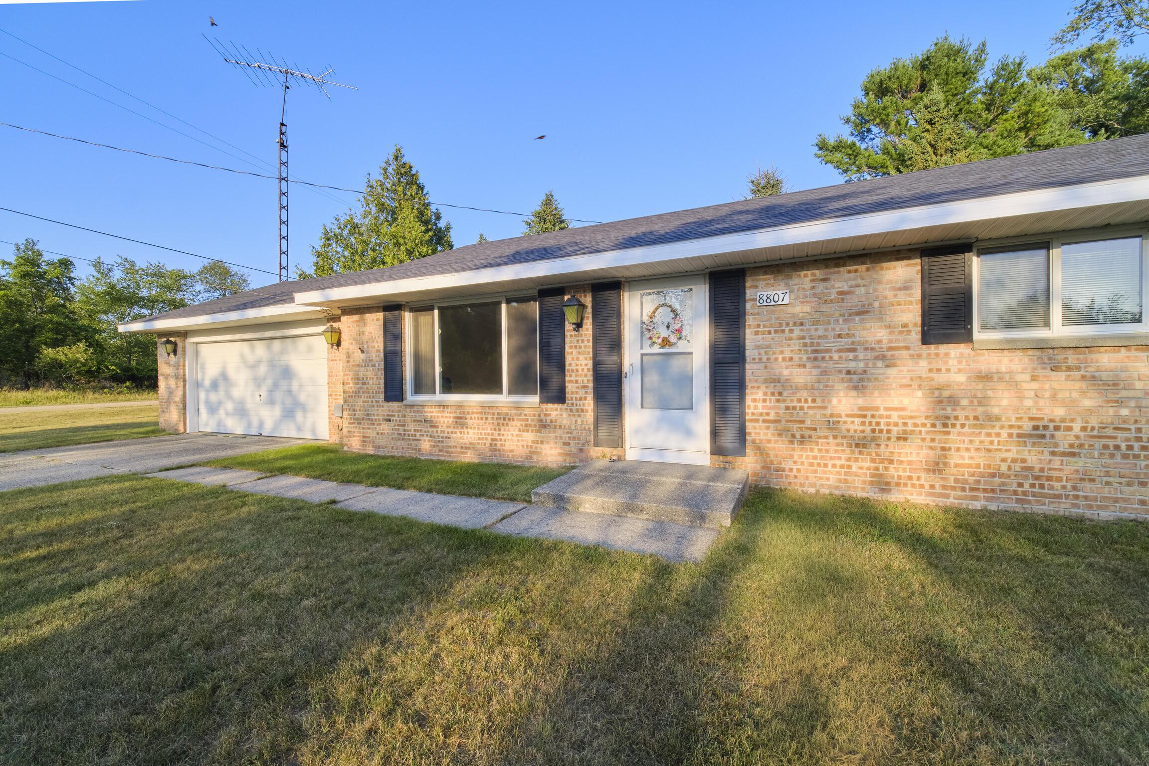 Image 4: Concrete drive & sidewalk to door