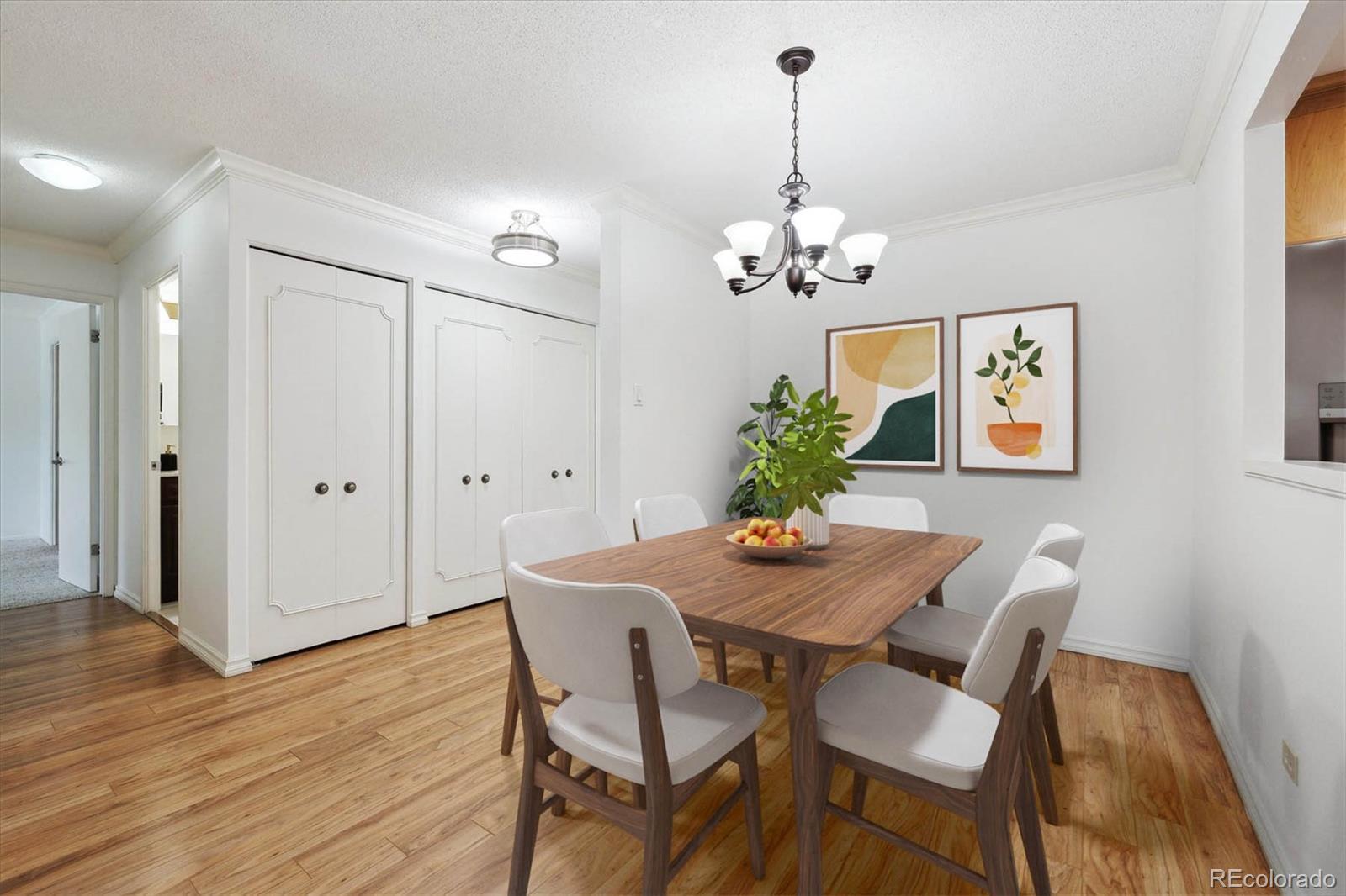 Image 3: Front Entry and Dining Room Space- Front Closet and Pantry Closet
