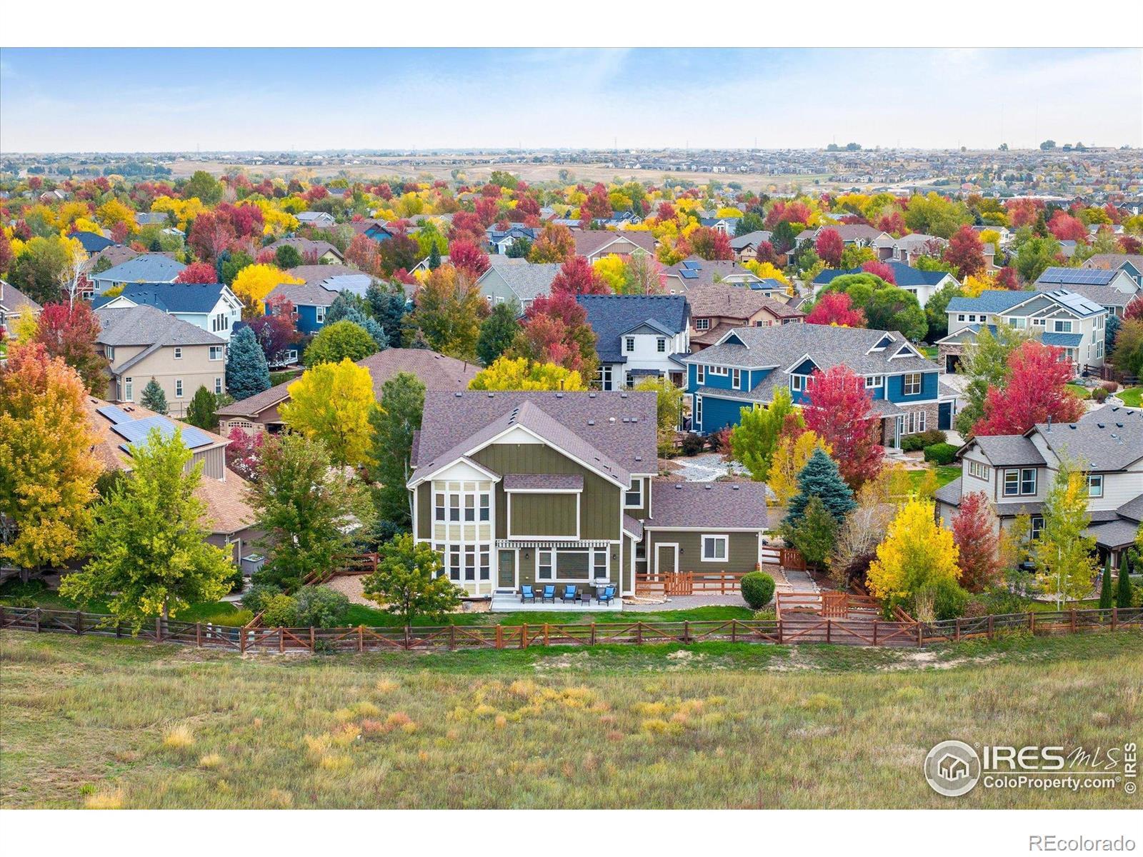 Image 2: aerial view highlighting the homes peaceful setting backing to open space and surrounded by vibrant fall colors Image 2: aerial view highlighting the homes peaceful setting backing to open space and surrounded by vibrant fall colors