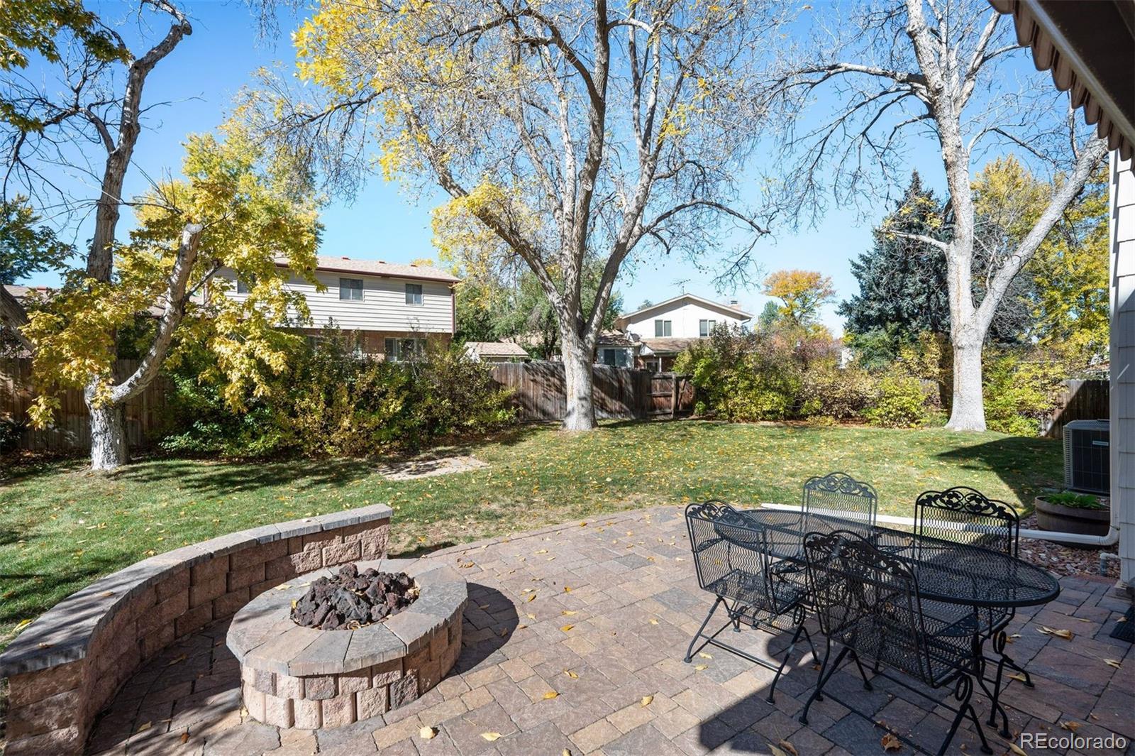 Image 4: Backyard is great with brick patio, gas fire pit, retractable awning, mature landscaping Image 4: Backyard is great with brick patio, gas fire pit, retractable awning, mature landscaping