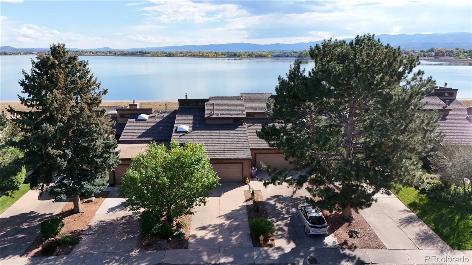 Image 1: Peaceful water and mountain views off your back deck of this stunningly remodeled townhome!