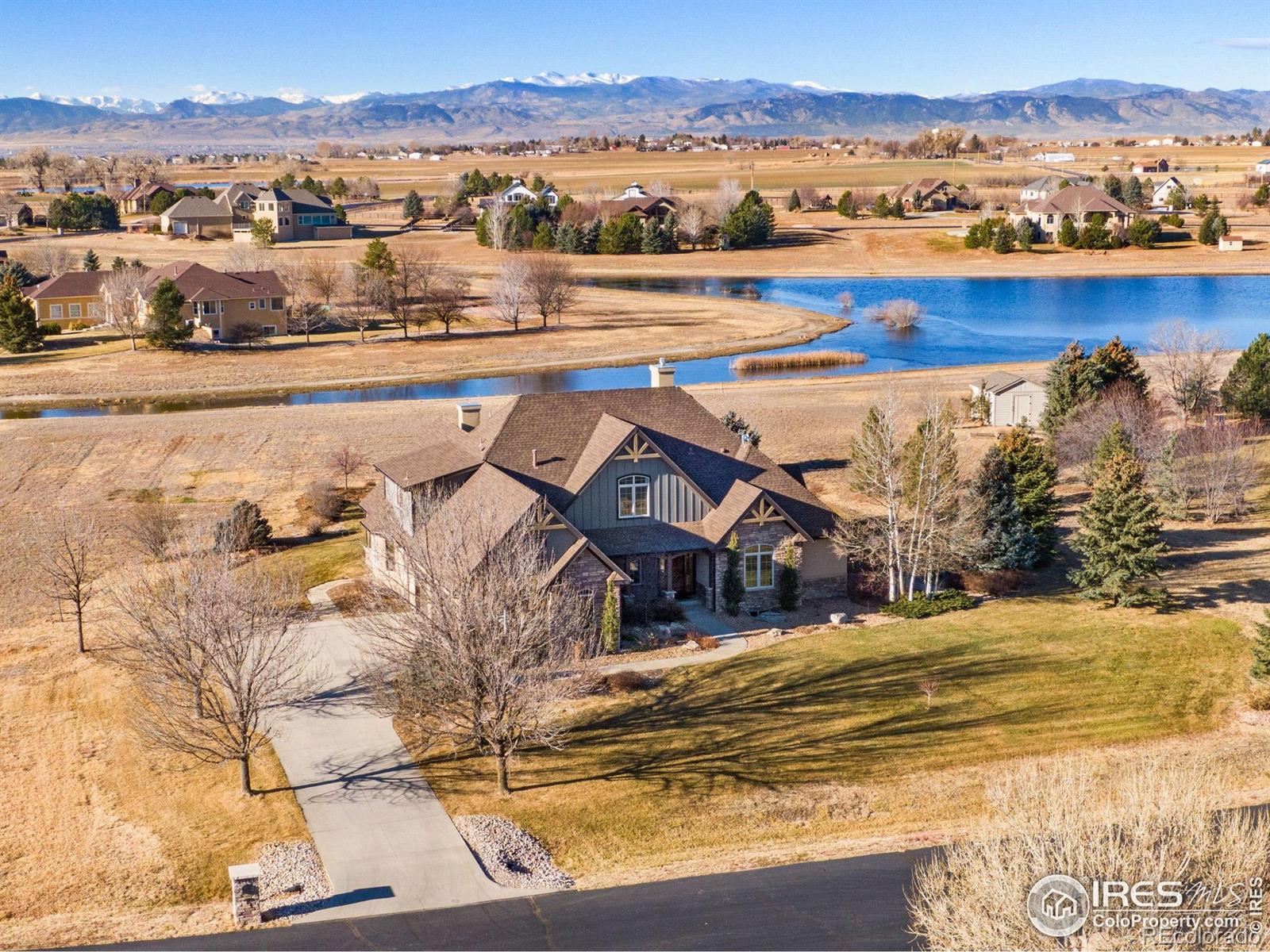 Image 2: Backing to open space and water with mountain views beyond and neighborhood walking paths.