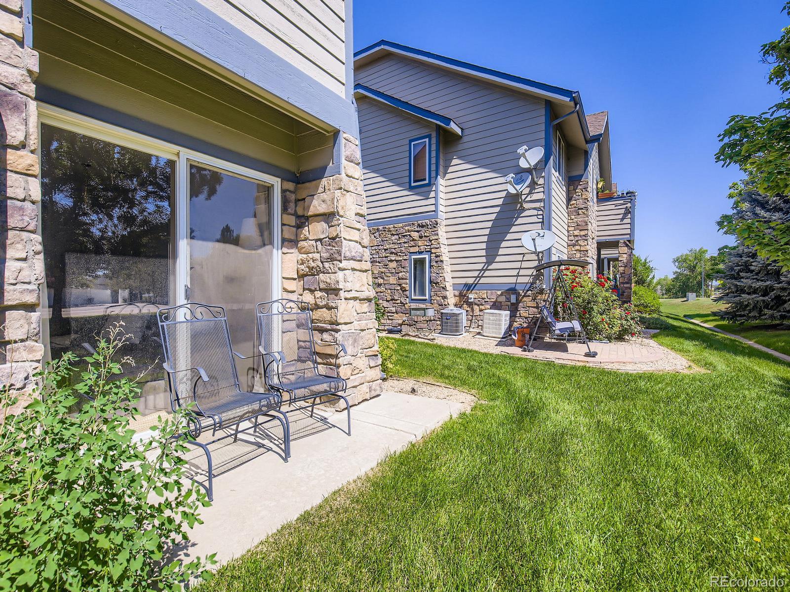 Image 3: Back patio is east facing and just across the street from Windsor Lake