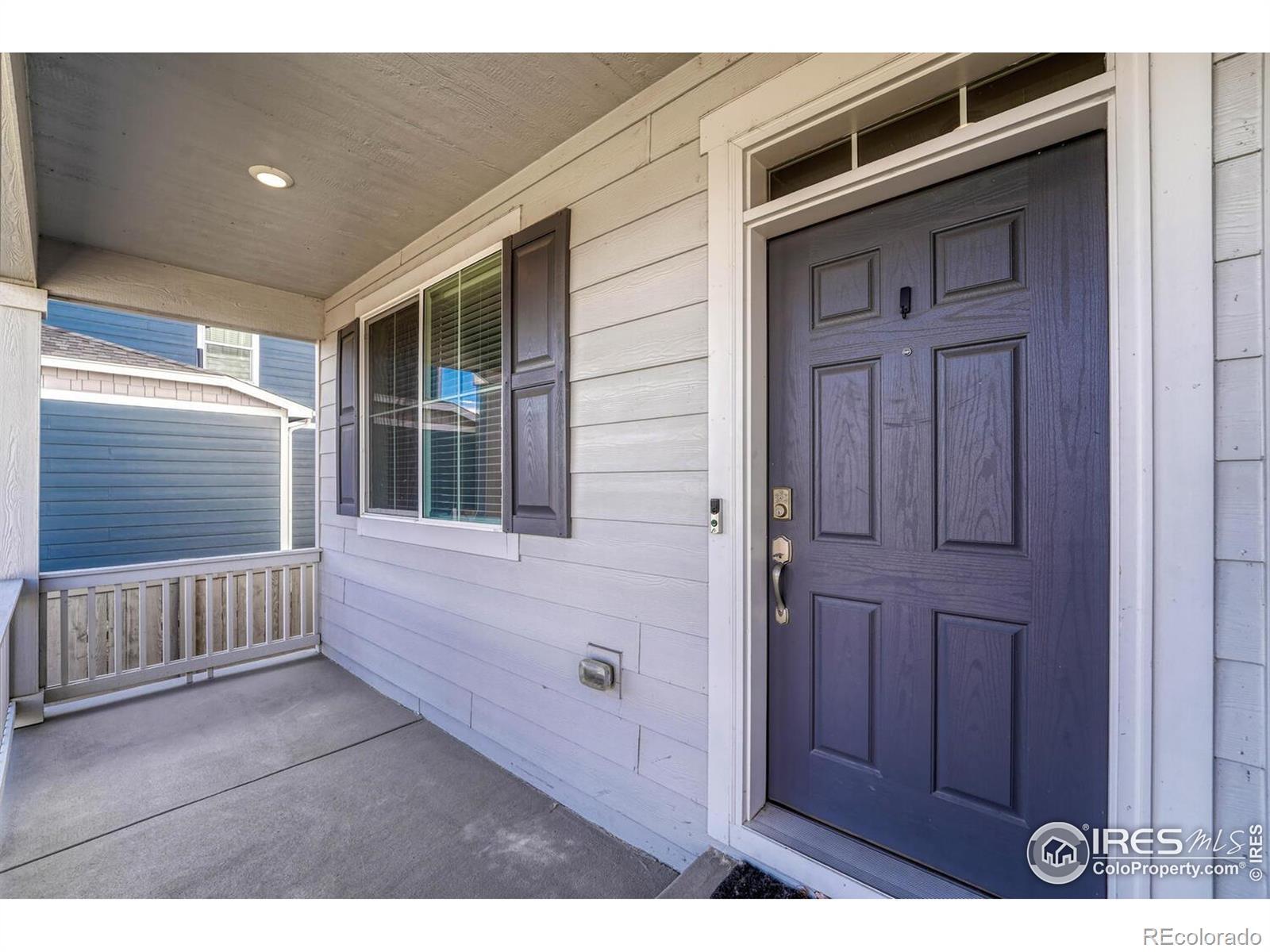 Image 3: Covered front porch across from a greenbelt to watch the world go by