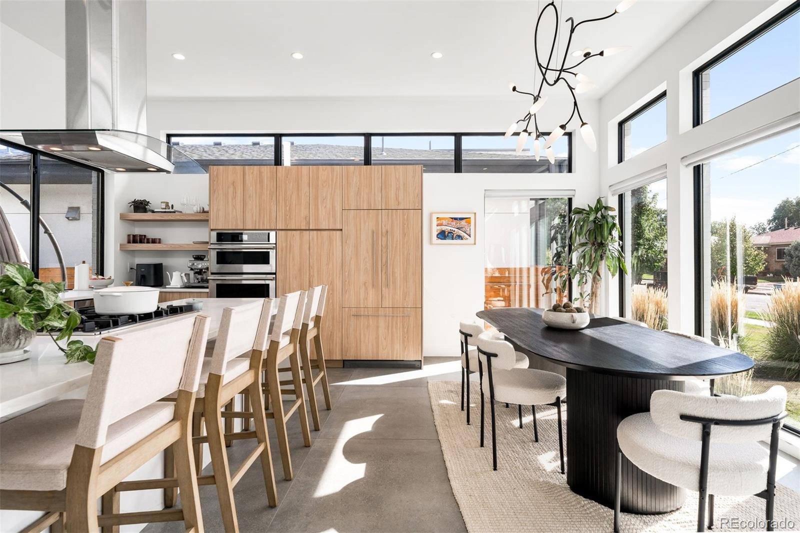 Image 2: Designated dining + casual island seating Image 2: Designated dining + casual island seating