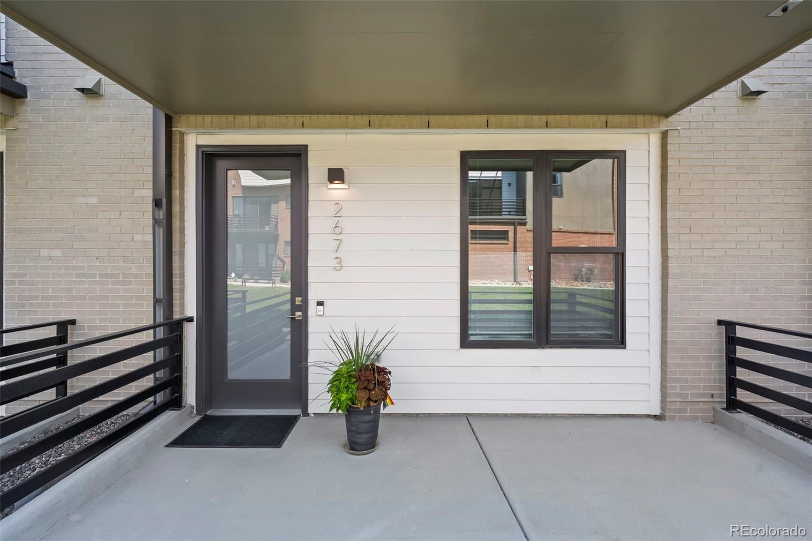 Image 3: An enclosed front patio welcomes you