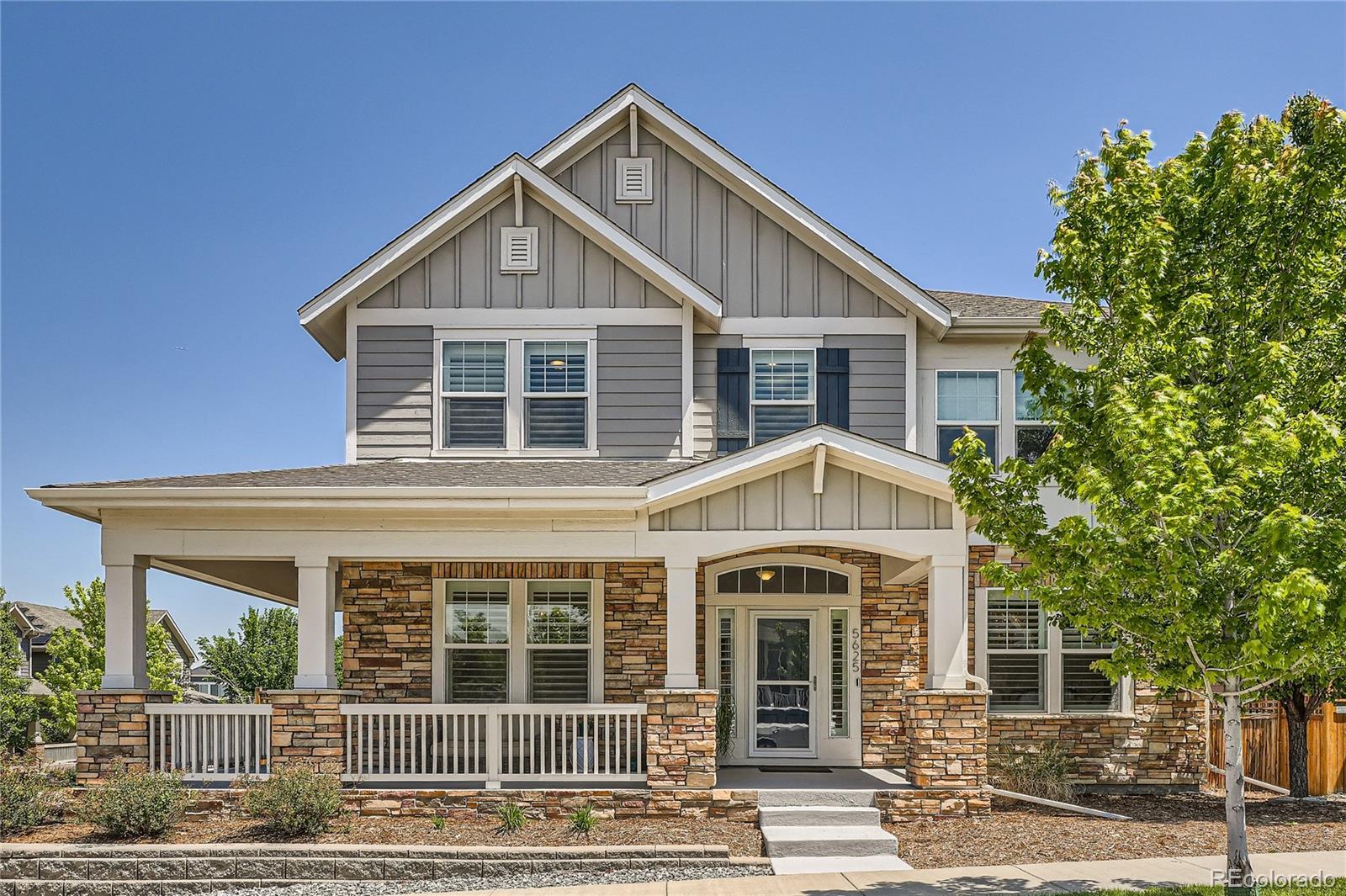 Image 1: A two-story dream home with a wrap-around covered patio.