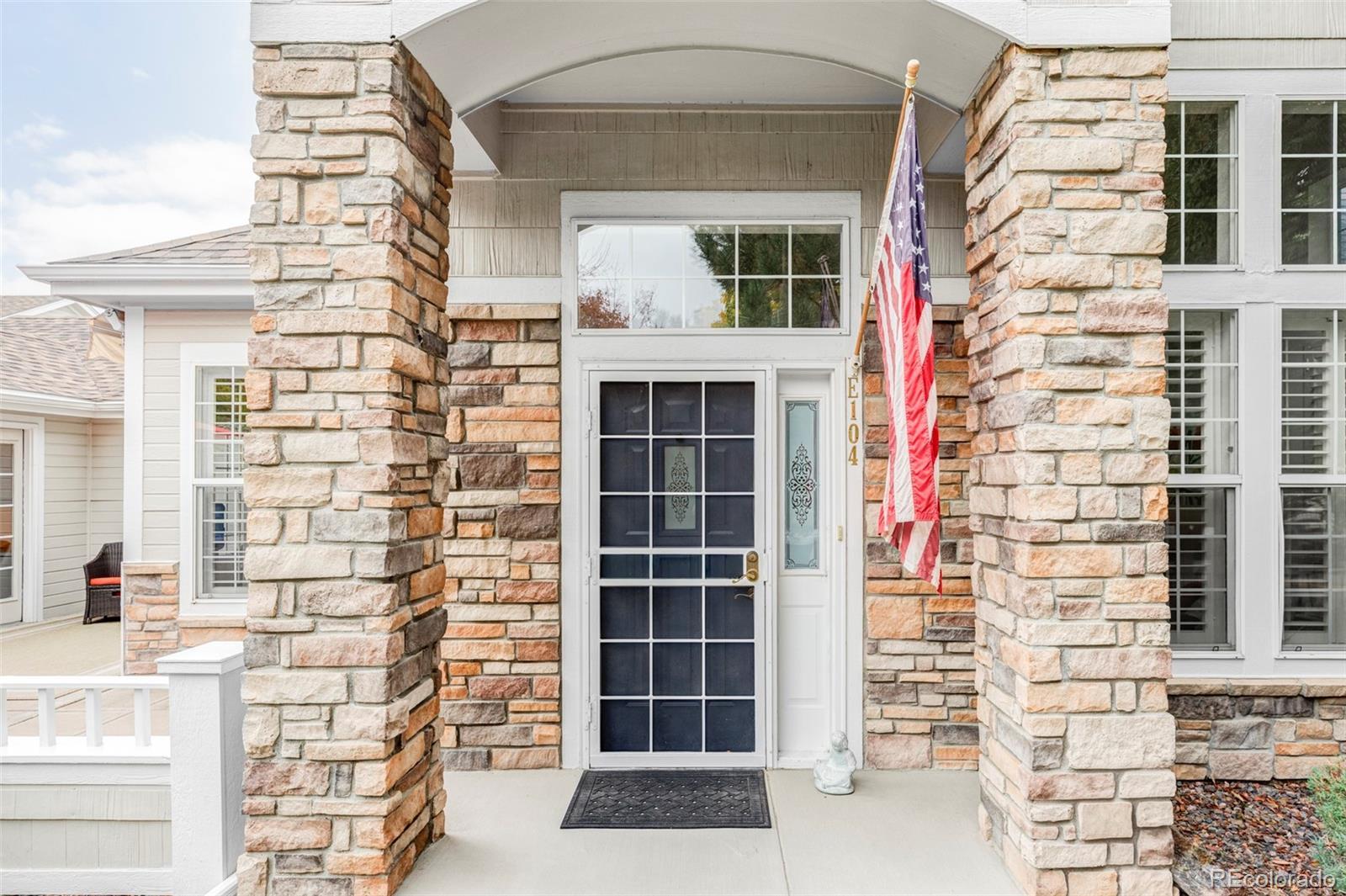 Image 2: Stone pillars and a custom security door accent the covered front entry, setting a warm and welcoming tone. Image 2: Stone pillars and a custom security door accent the covered front entry, setting a warm and welcoming tone.