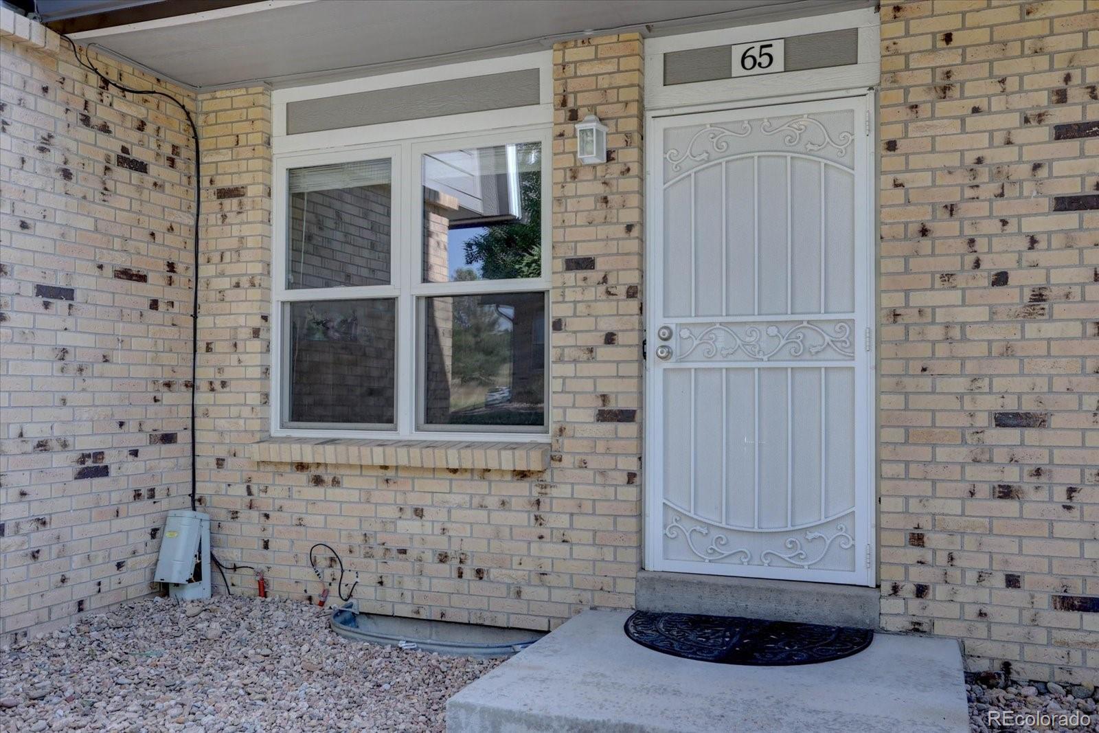 Image 3: Welcoming private entry lined with classic brickwork.