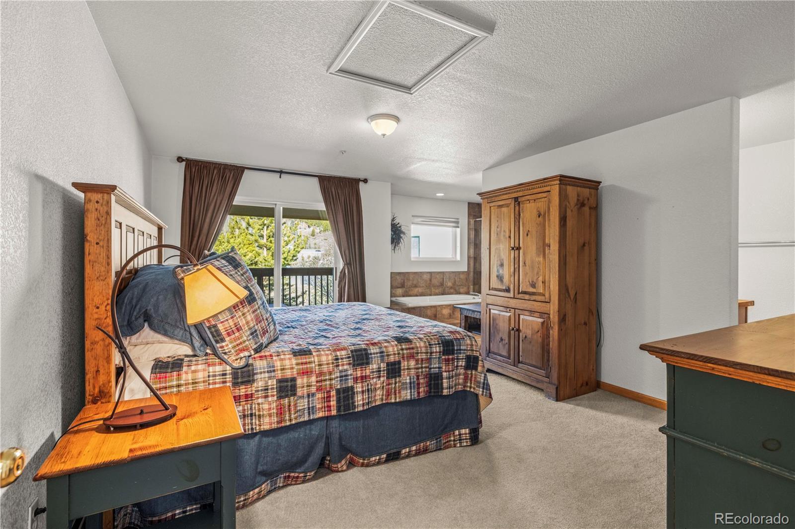 Image 2: Primary suite and covered deck Image 2: Primary suite and covered deck