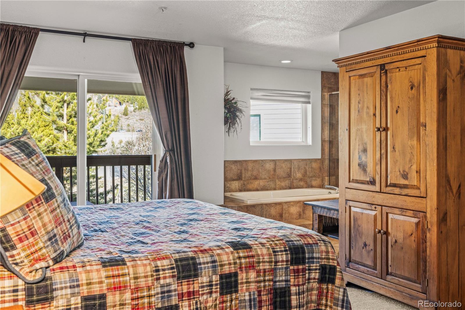 Image 3: Primary suite and covered deck Image 3: Primary suite and covered deck