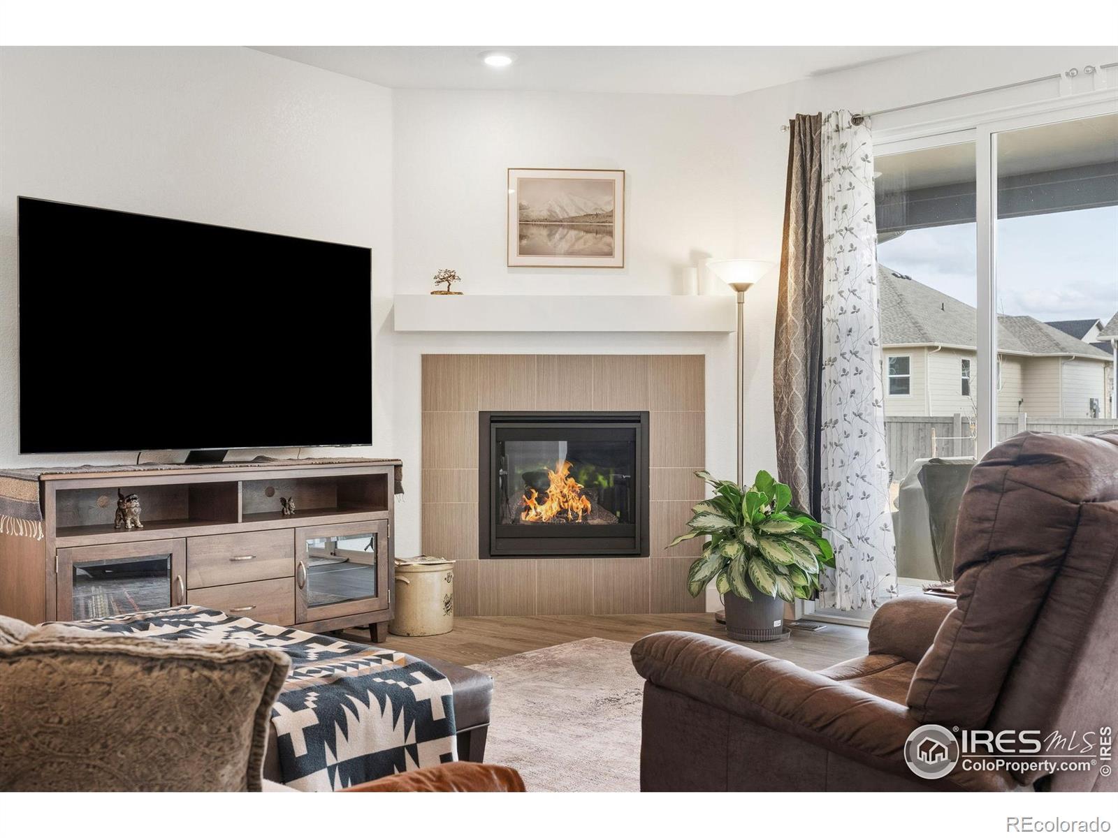 Image 3: Living Room with Cozy Gas Fireplace