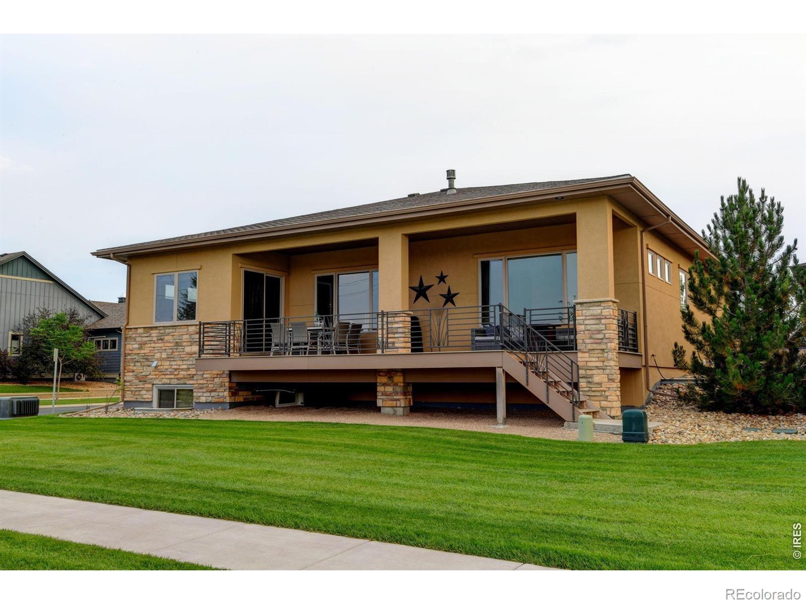 Image 3: Large covered back patio with Mountain views and open fields. Daylight Basement