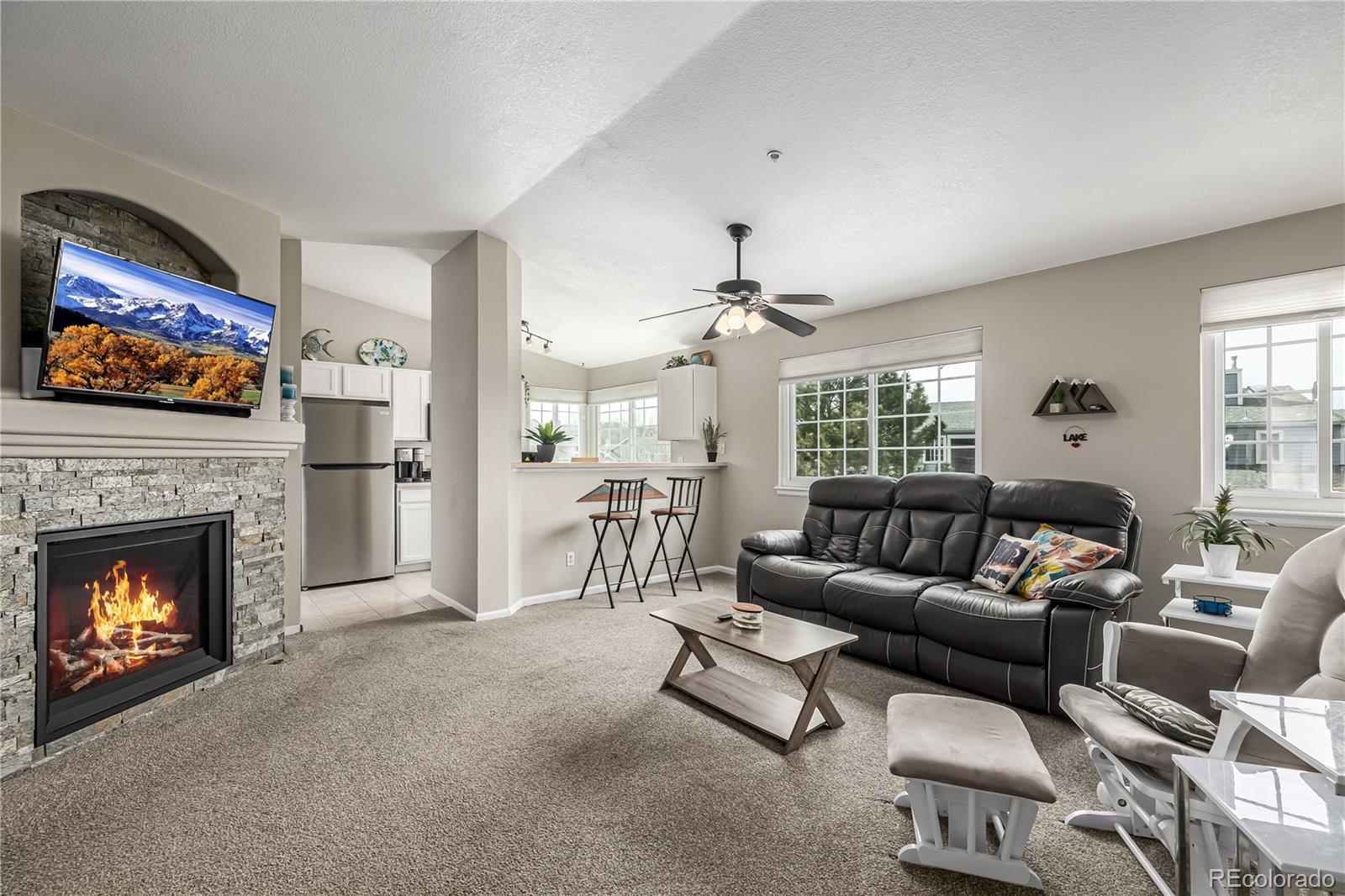 Image 3: Cozy gas fireplace and lake views.