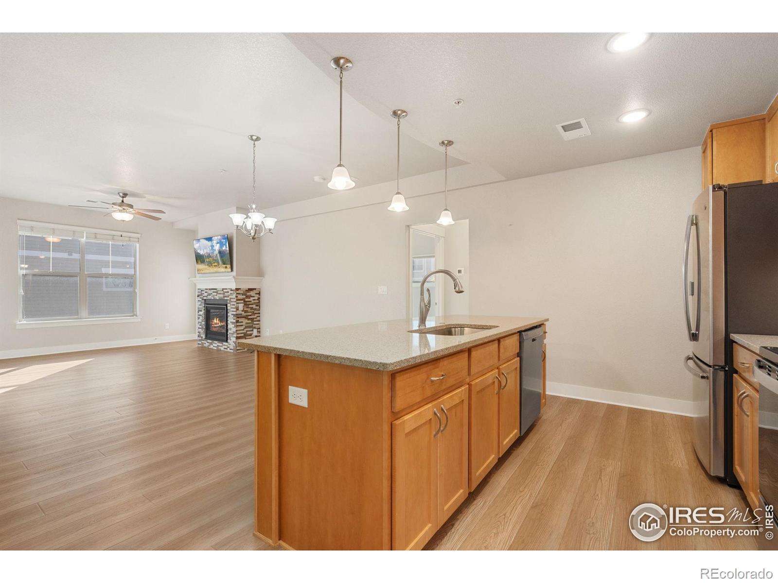 Image 4: Open floorplan with high ceilings and generous kitchen cabinets and Island