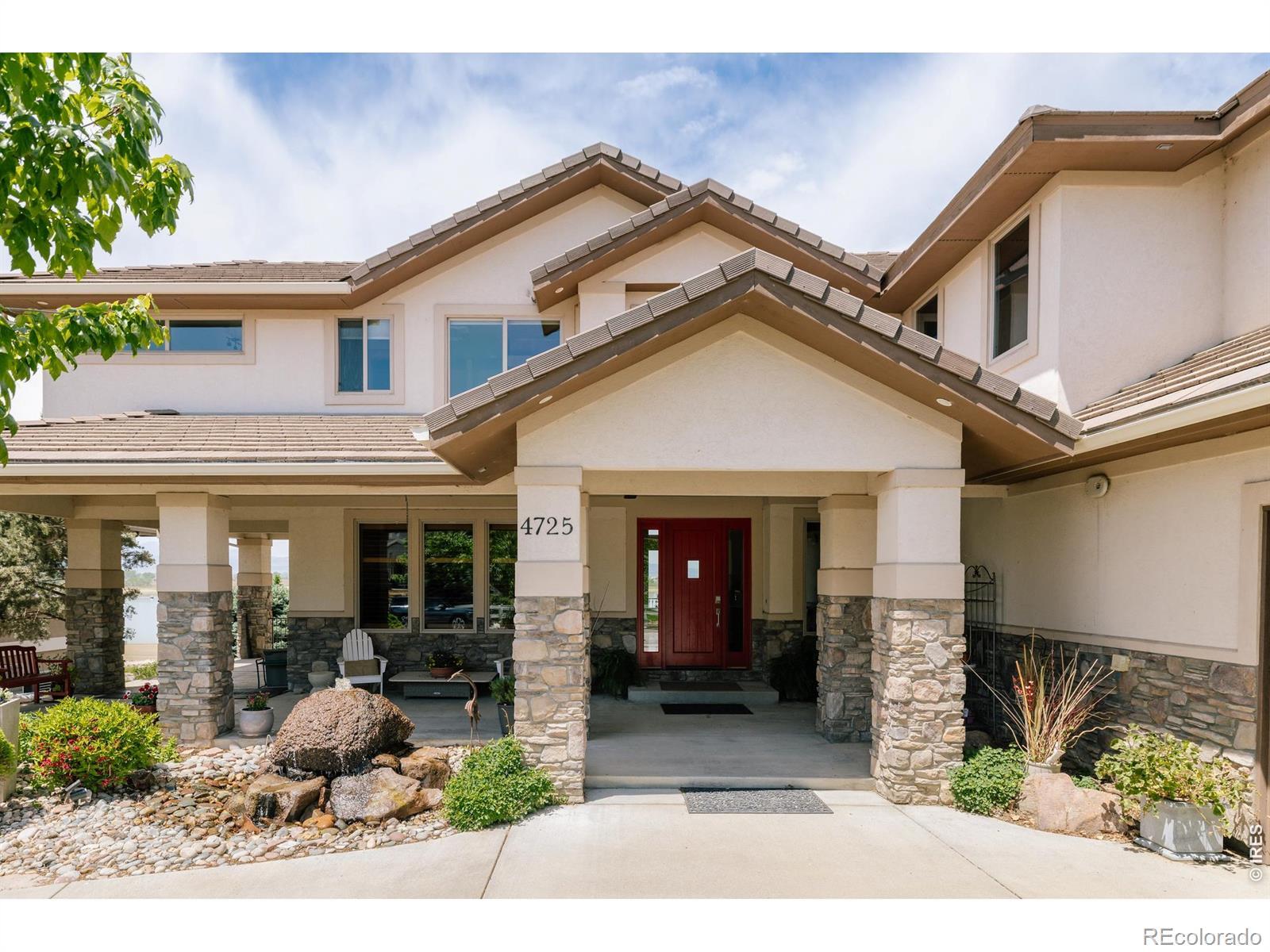Image 2: Water feature and covered front porch. Image 2: Water feature and covered front porch.