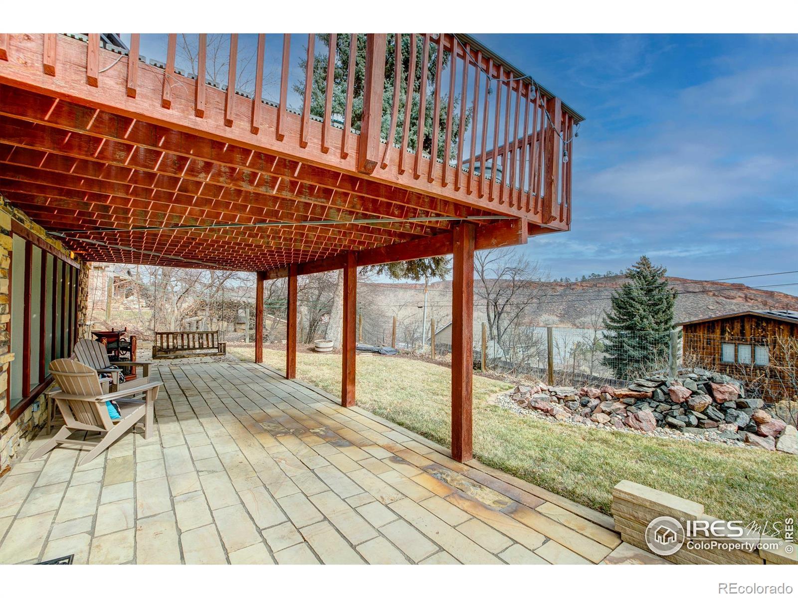 Image 3: Lower walkout level paved patio with access to the lower living area