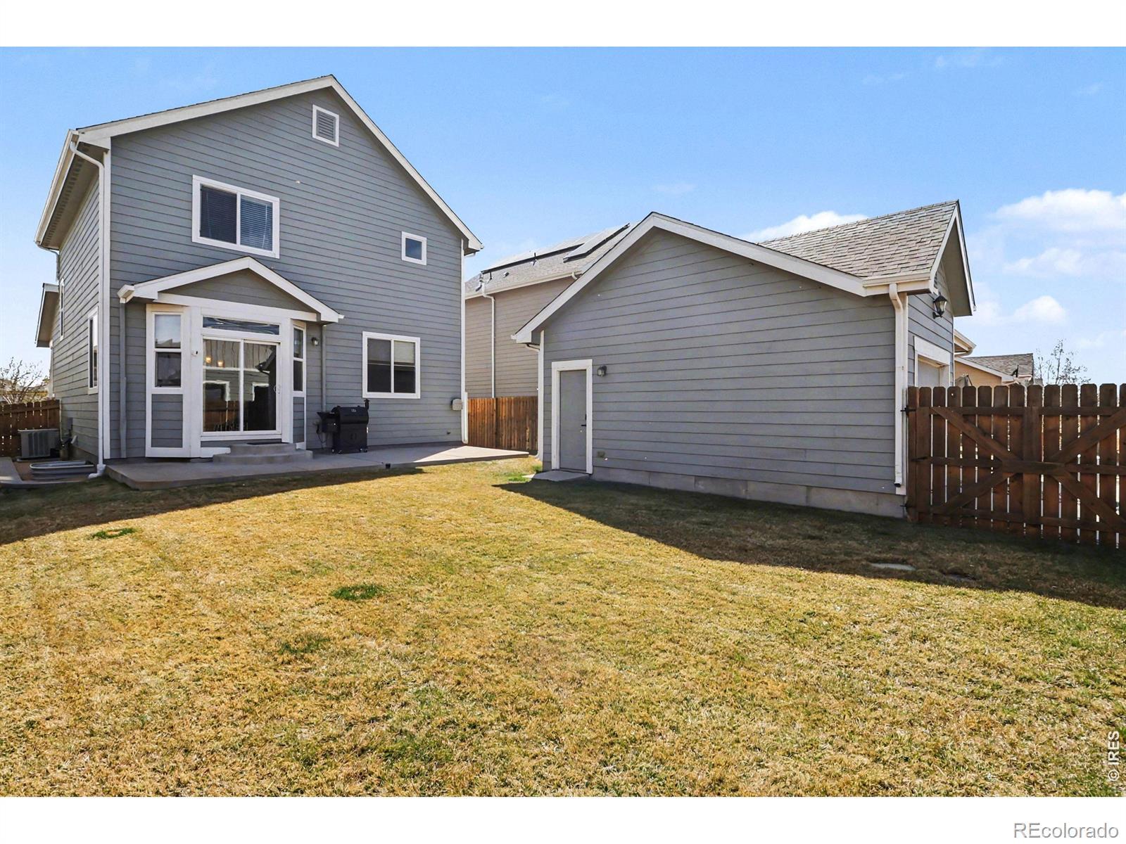Image 3: Full privacy fence, amazing yard, and patio access all make the PERFECT yard for entertaining or family time!