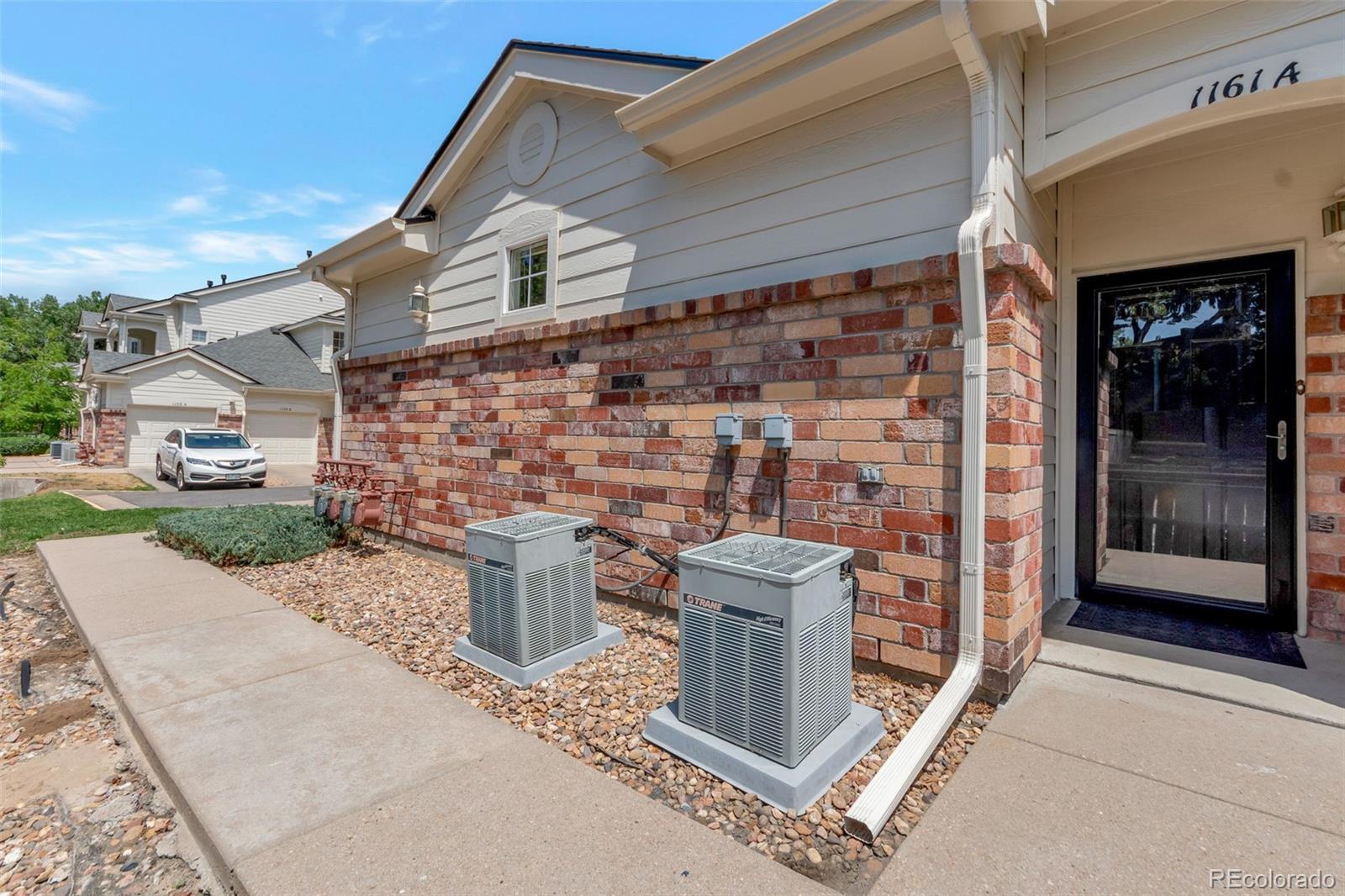 Image 1: Covered west-facing entry with security/storm door. Image 1: Covered west-facing entry with security/storm door.