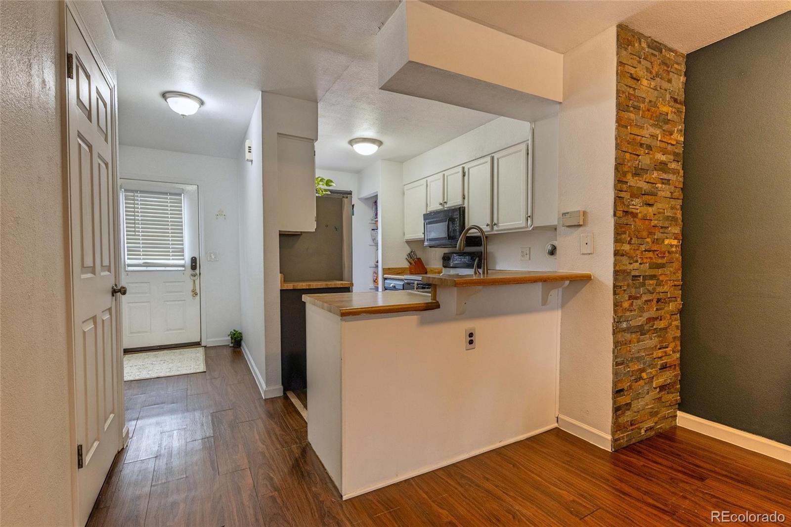 Image 4: Dining Area looking into Kitchen and Entry Image 4: Dining Area looking into Kitchen and Entry