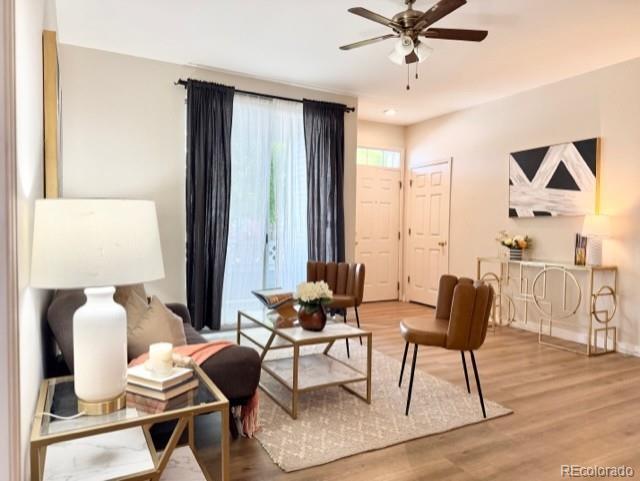 Image 1: Living room, access to private, covered patio, and entry to your new home.