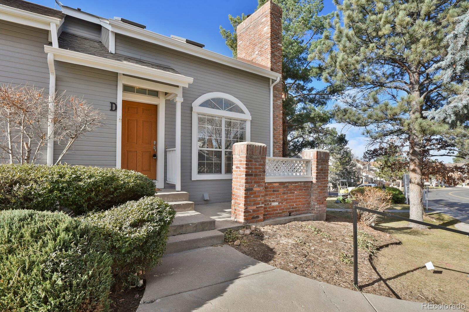 Image 1: End Unit front door with patio area