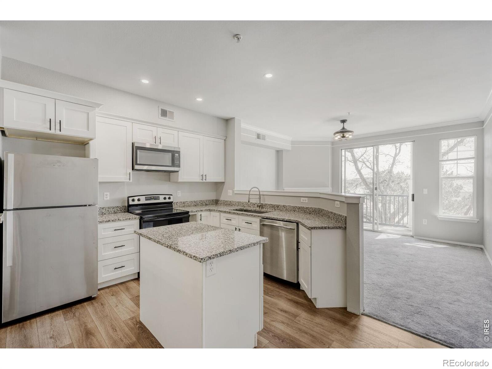 Image 4: Kitchen with new cabinets, granite counters and stainless appliances