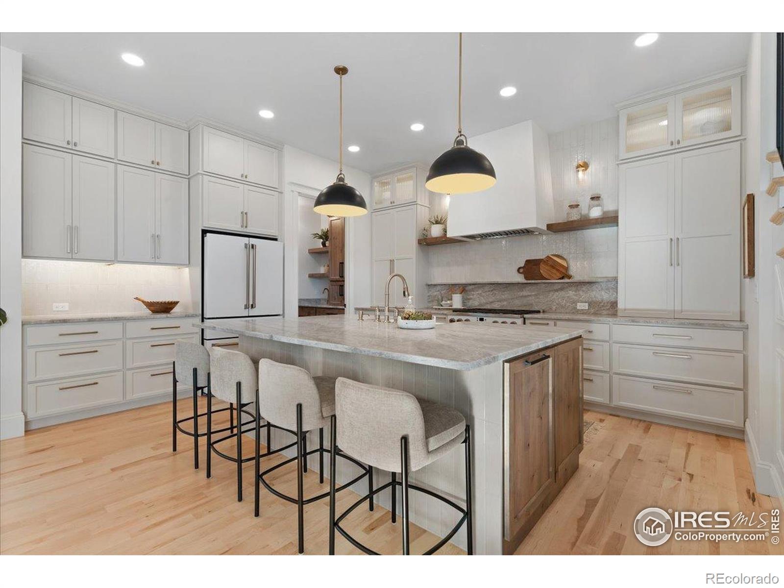 Image 4: Custom Kitchen with Quartzite Counters and Custom Cabinets