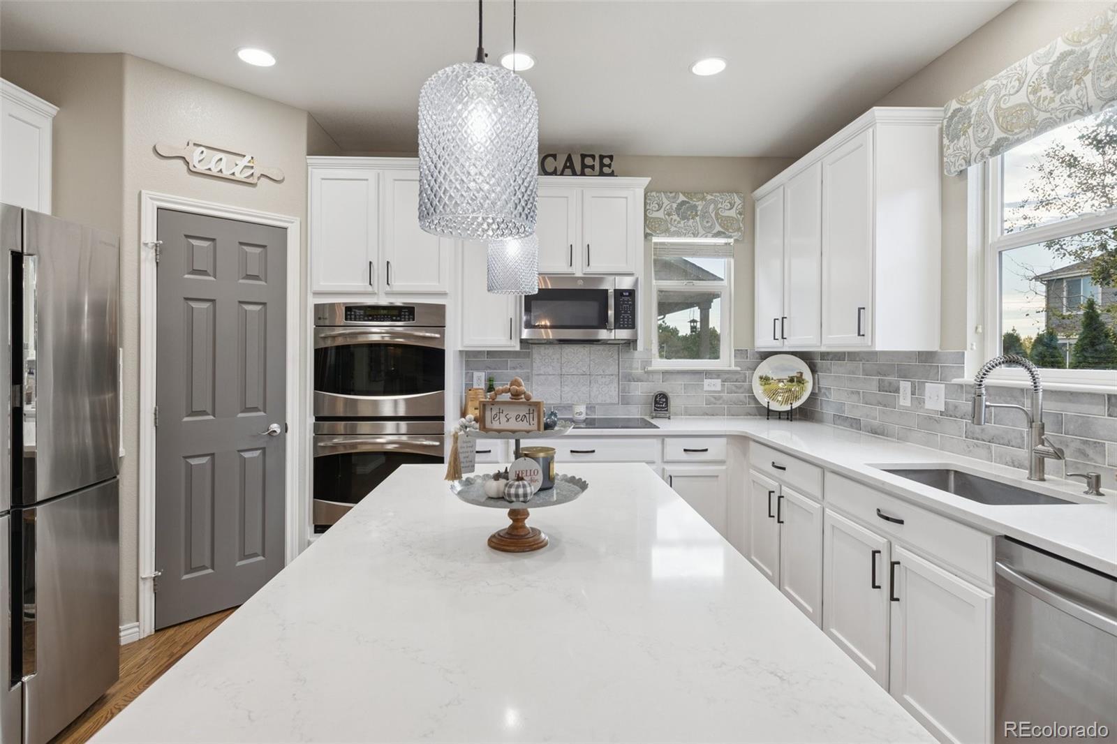 Image 3: Completely renovated - new cabinets, quartz counters, tile backsplash, lighting, and all new appliances,, Image 3: Completely renovated - new cabinets, quartz counters, tile backsplash, lighting, and all new appliances,,