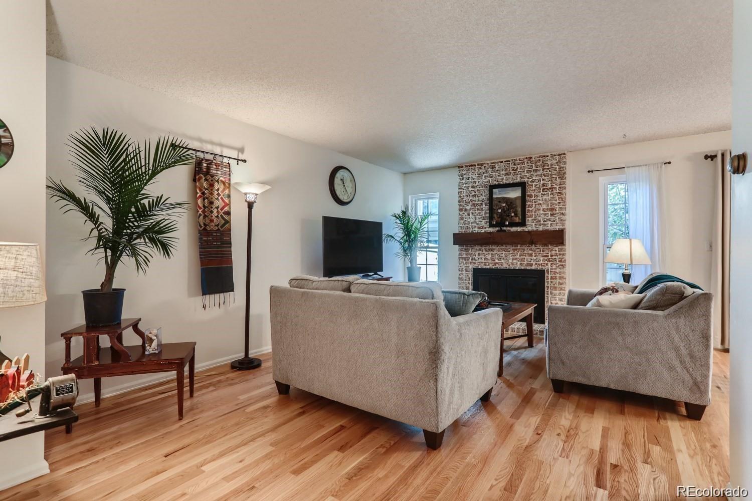 Image 2: Living Room. Hardwood Floors and Fireplace