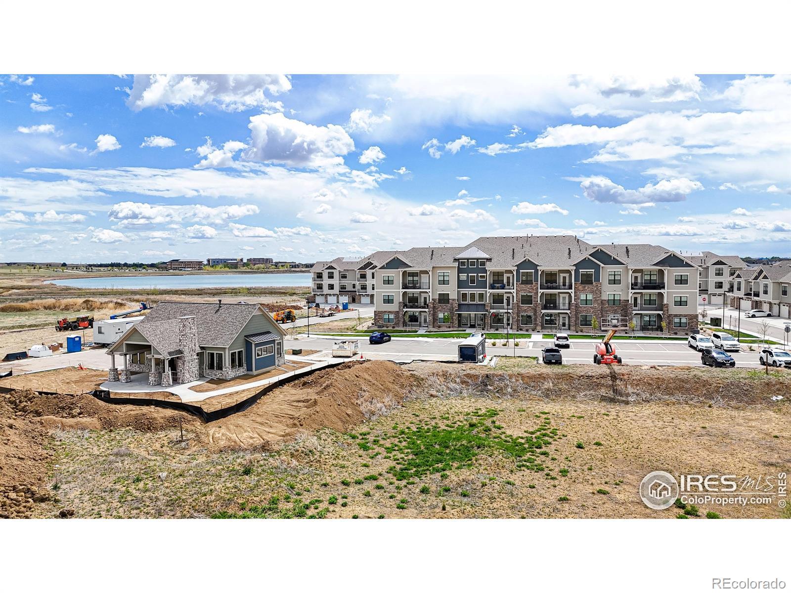 Image 3: View of the Clubhouse / Exercise Facility with the 4250 building just across the parking lot. 2 Pickleball Courts to be added as well.