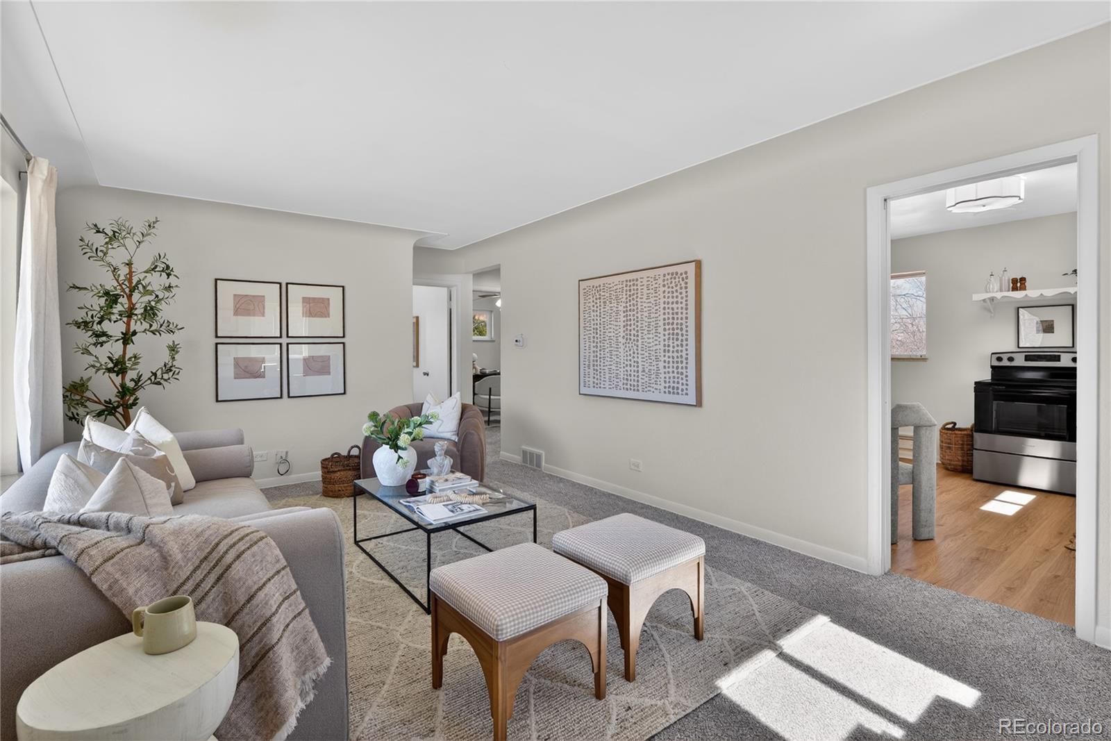 Image 3: A large, welcoming living room greets you upon entry.