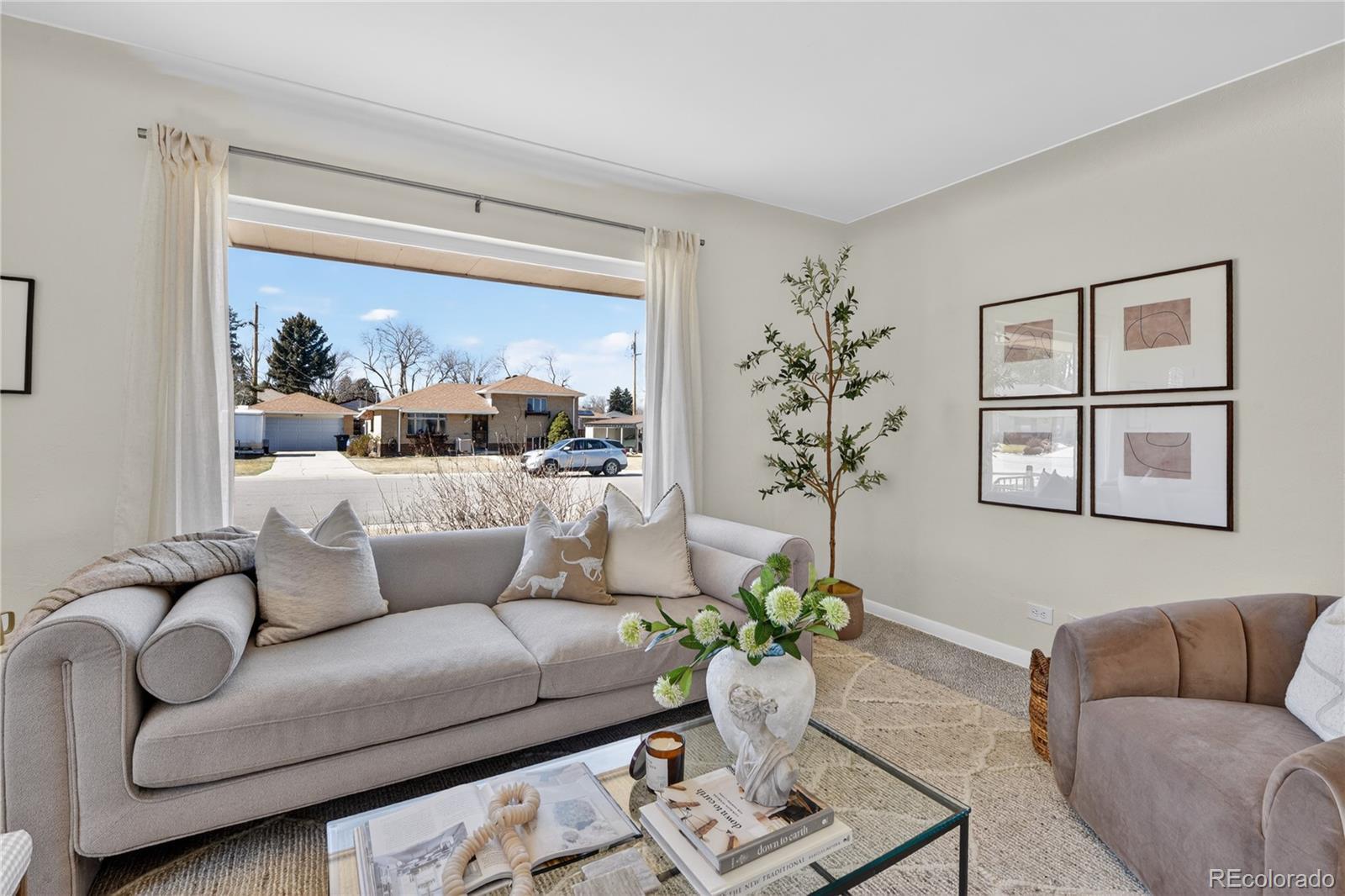 Image 4: Living room featuring a large window and abundant natural light.
