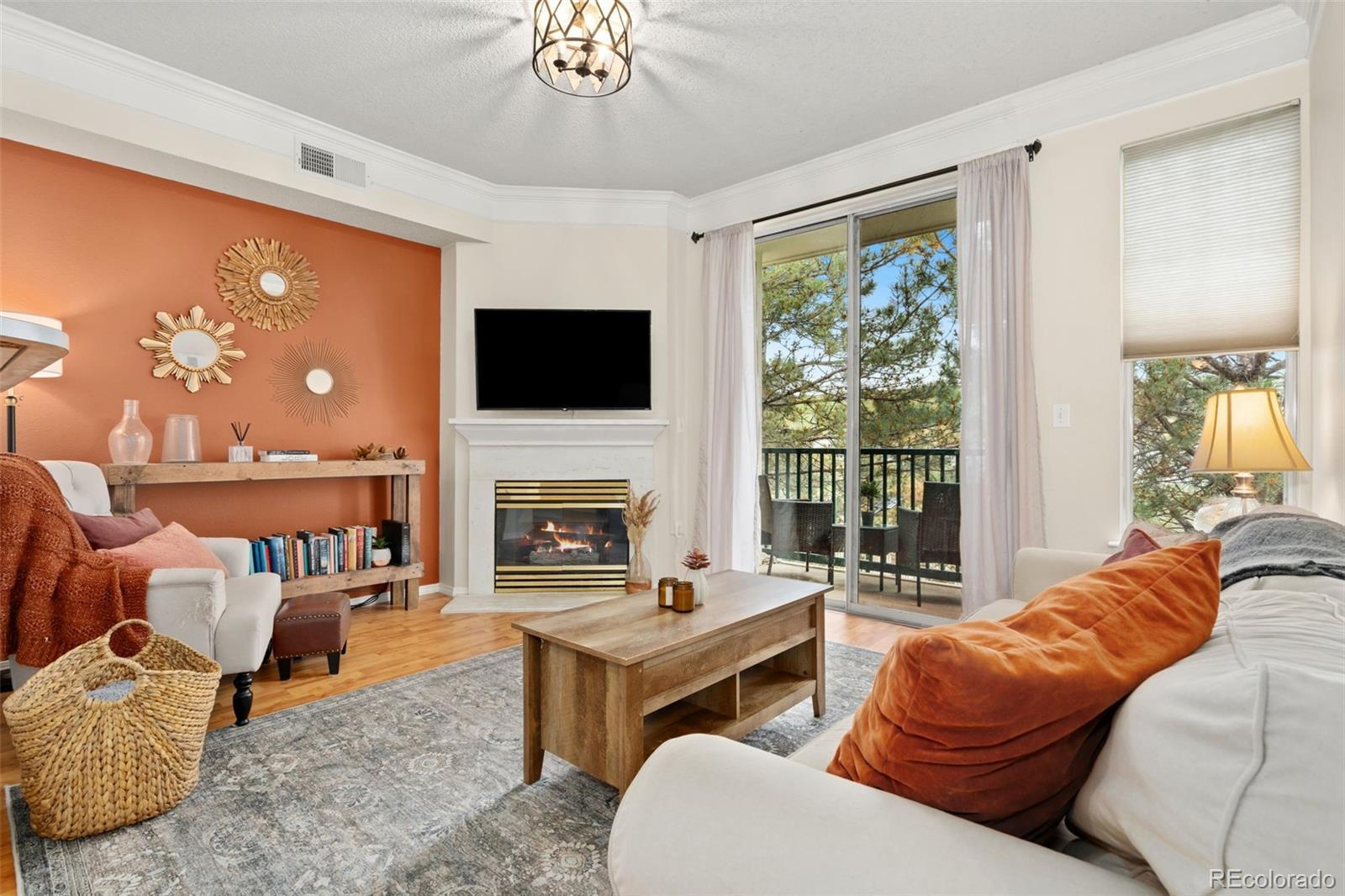 Image 1: Open Living Room with Gas Fireplace and Deck