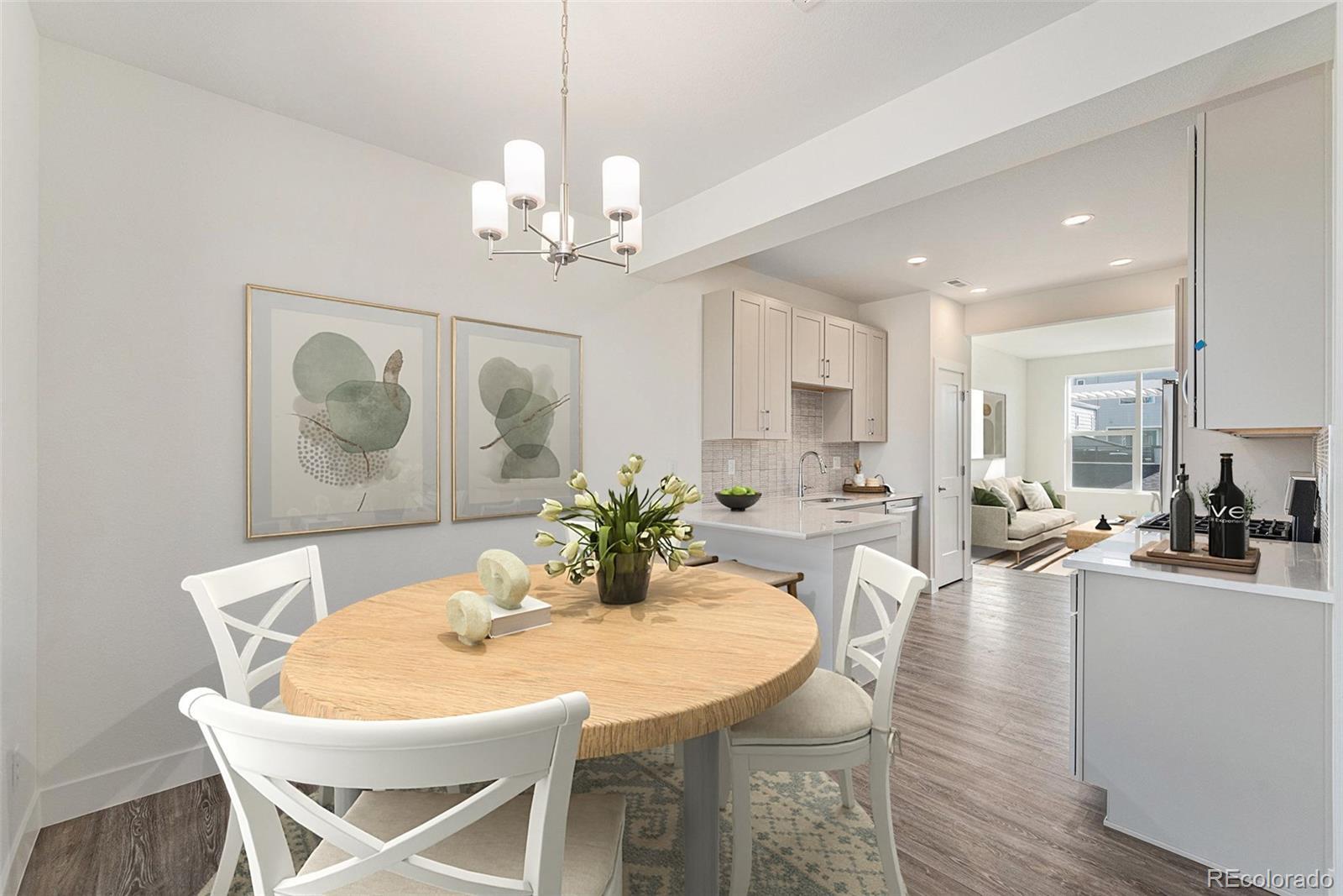 Image 1: Dining room and breakfast bar w/ covered balcony (virtually staged)