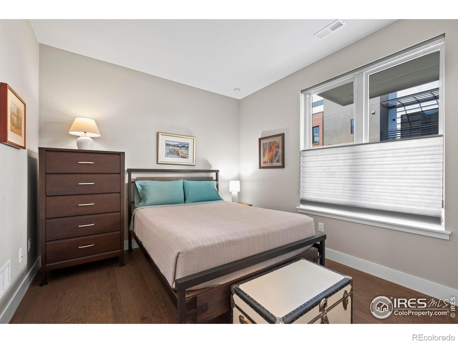 Image 3: 1st floor bedroom with ensuite bath is the perfect guest suite, home office or workout space