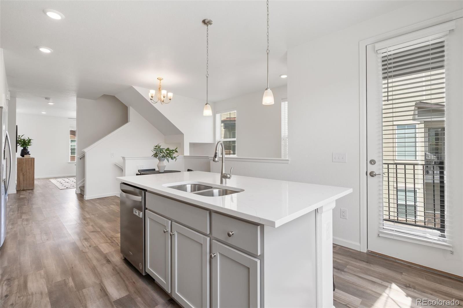 Image 2: Main Level open-concept dining area + kitchen