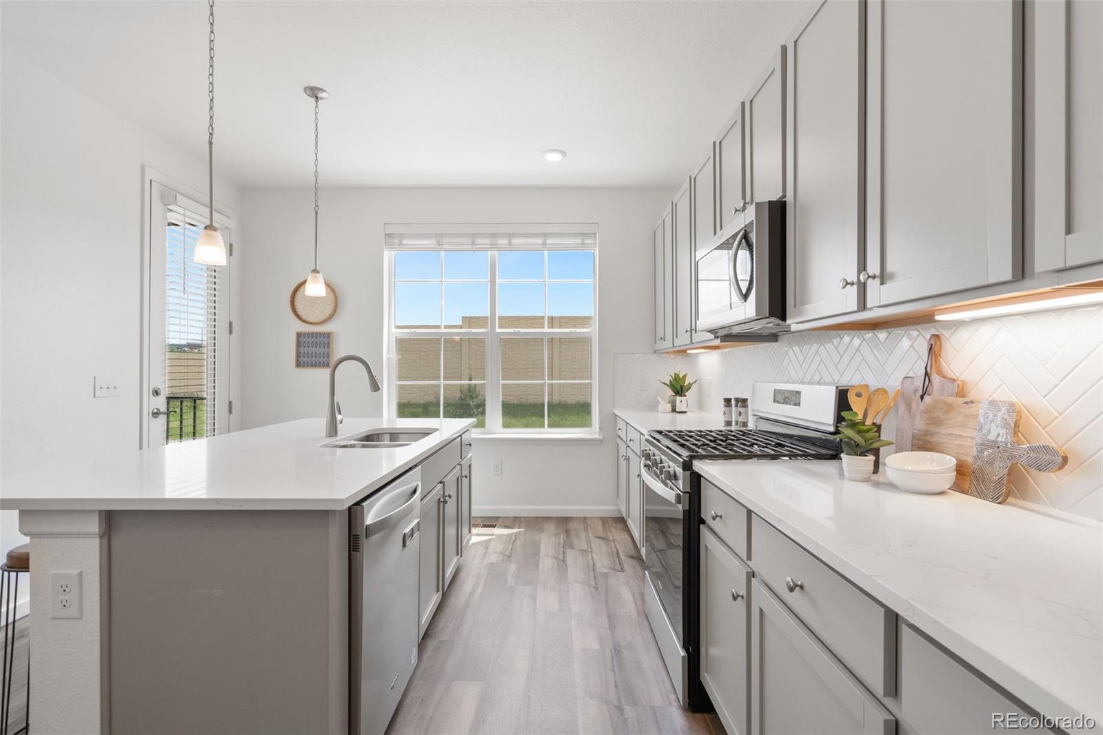 Image 3: Main Level open-concept dining area + kitchen