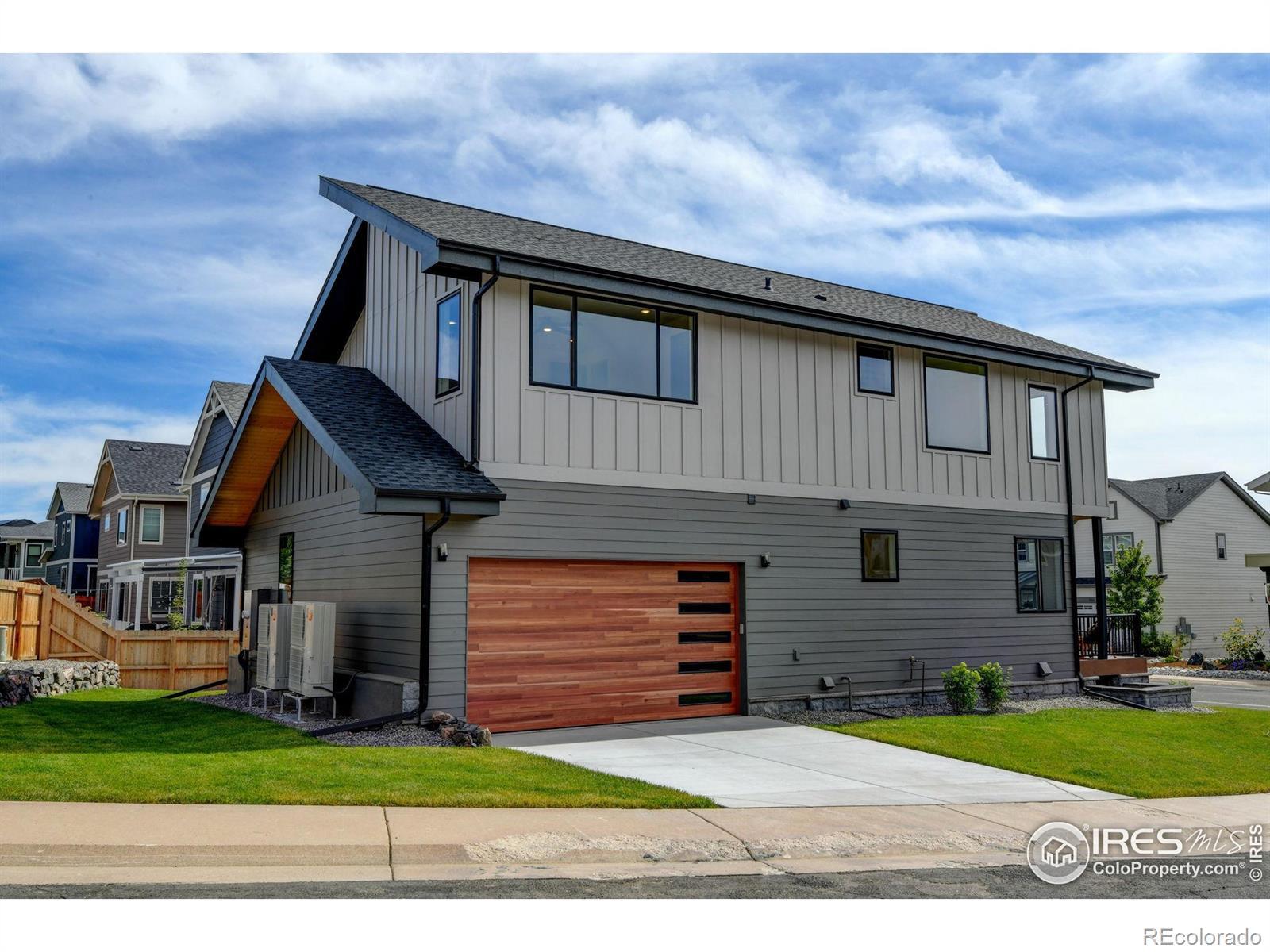 Image 4: Spacious oversized garage with workshop area and large storage closet.