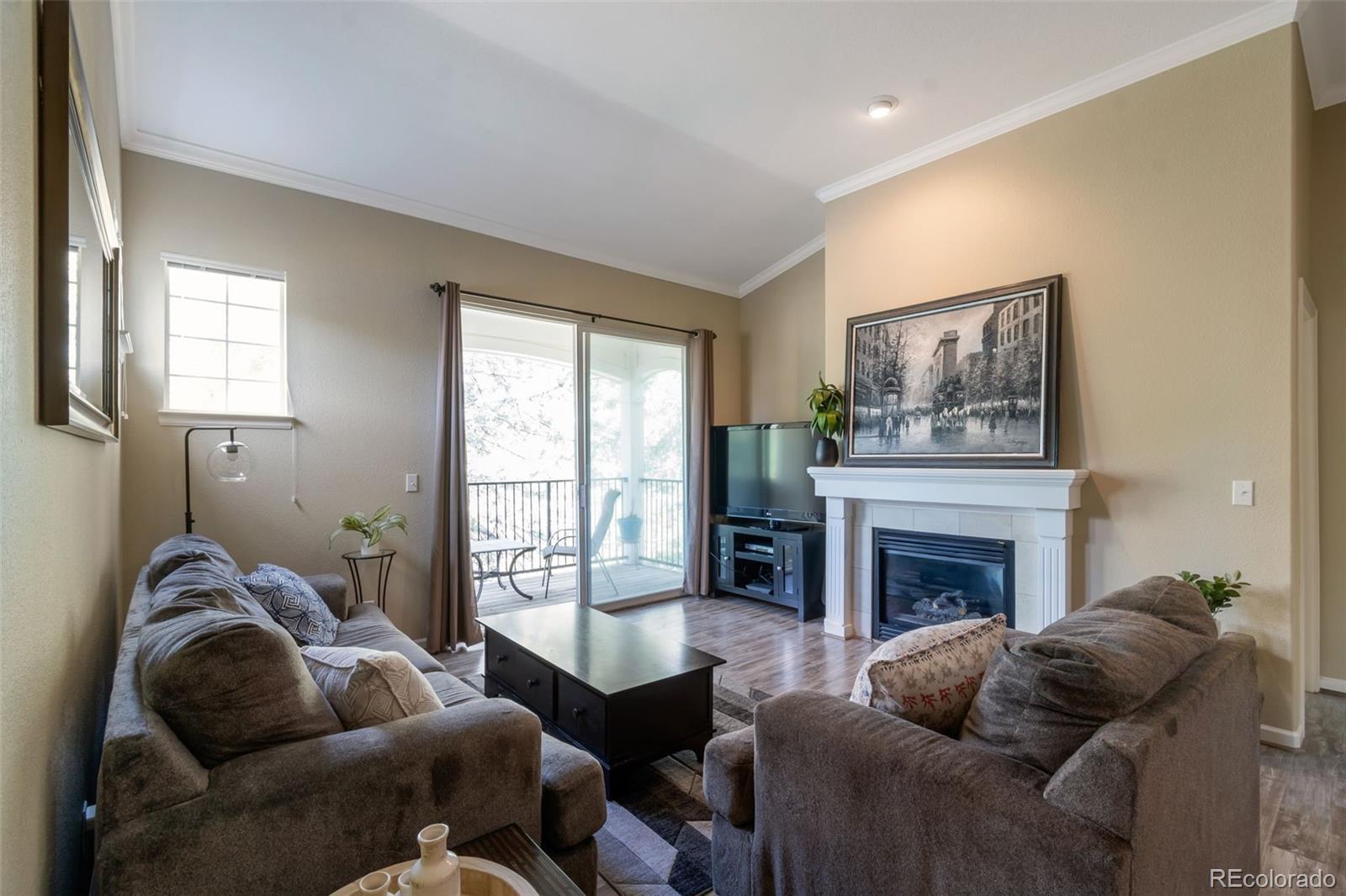 Image 2: Living room with gas fireplace.
