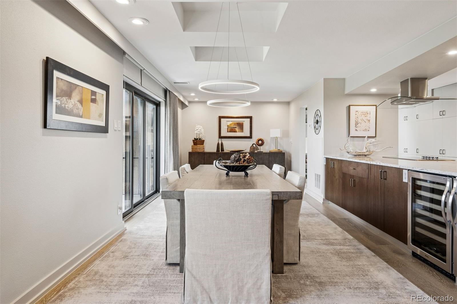 Image 3: Dining area adjacent to kitchen and beverage cooler.