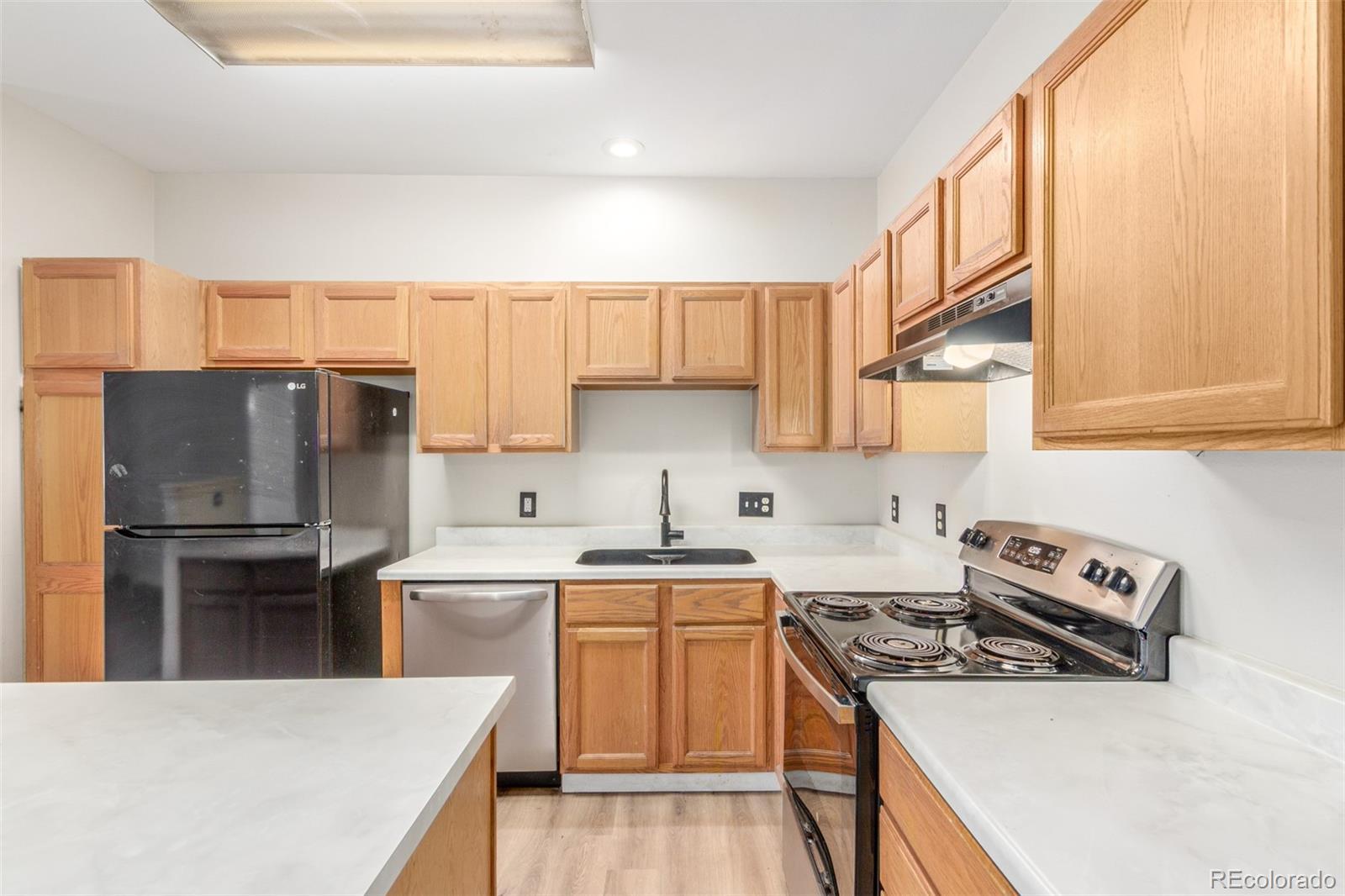 Image 1: Kitchen features NEW Range, newer appliances, large island and generous cupboard space including a pantry
