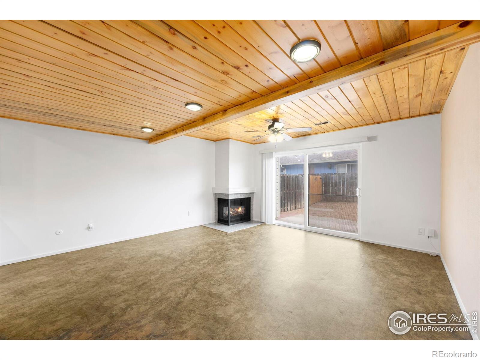 Image 4: Large lower level living space with a gas fireplace