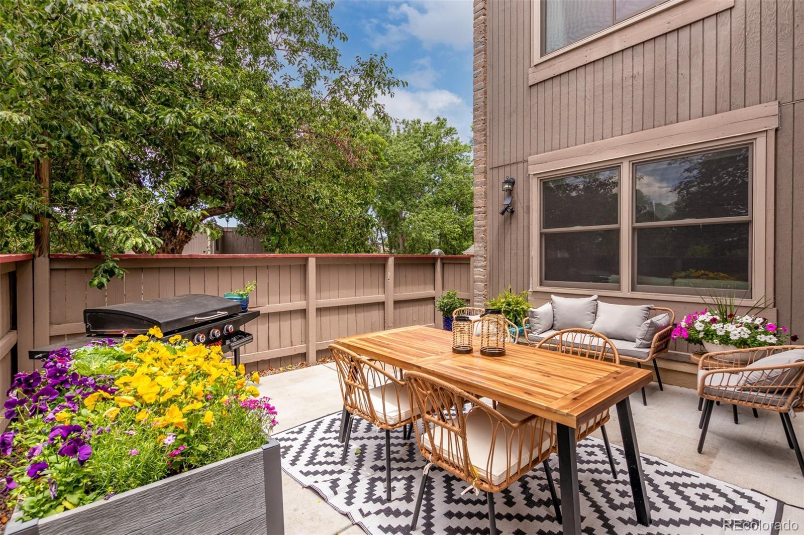 Image 3: This corner unit townhome has a rare corner lot with extra space and privacy.
